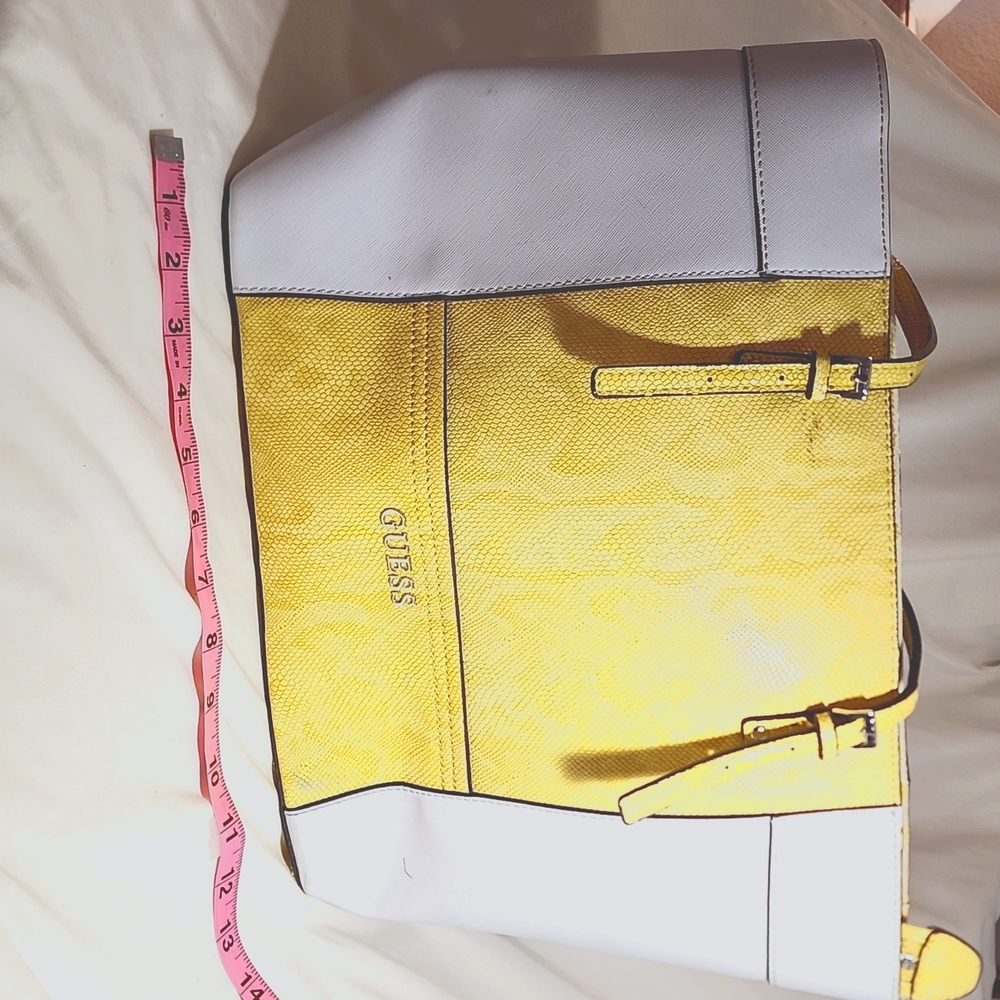 Guess yellow & white purse. Gently used. Worn on the straps (included in photo)